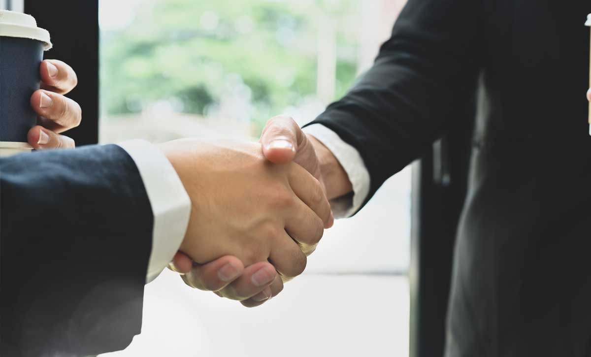 Two business partners shaking hands