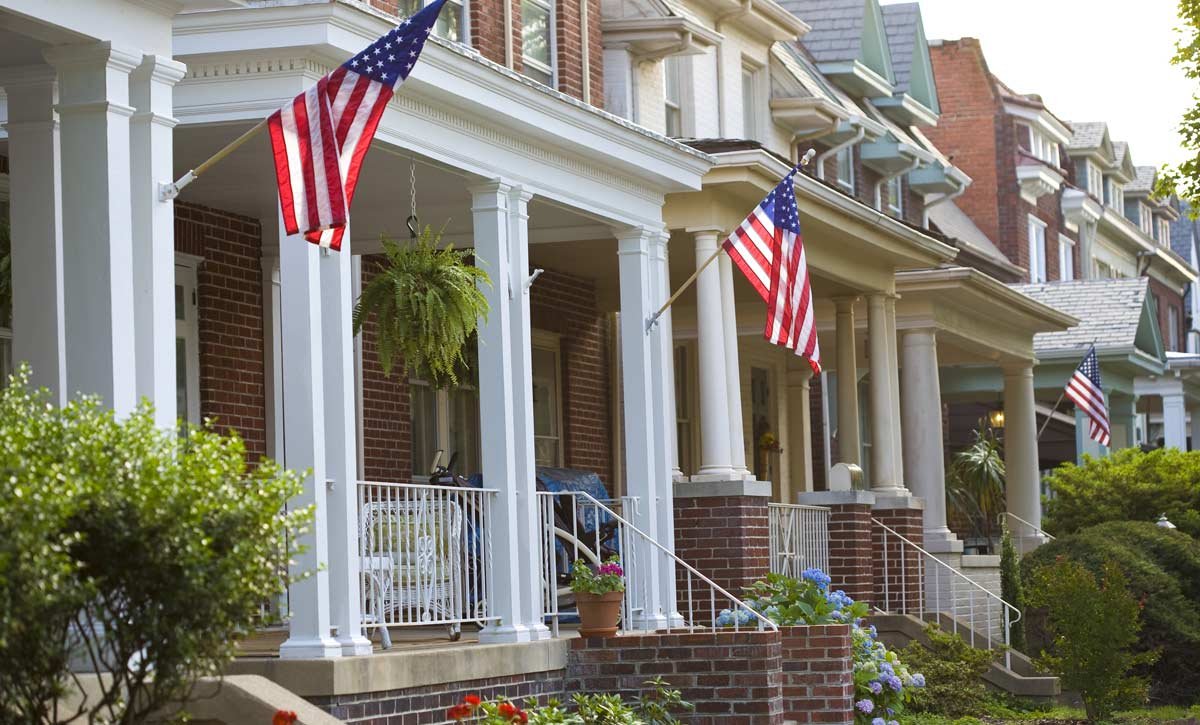 Patriotic Homes with American flags on the front porches
